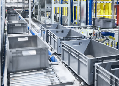 Conveyor system with boxes in motion, shallow depth of field.